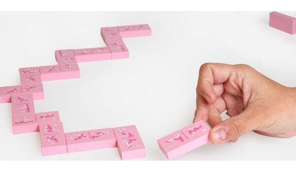 Secret Play Kinky Domino wooden adult domino game with its illustrated tiles