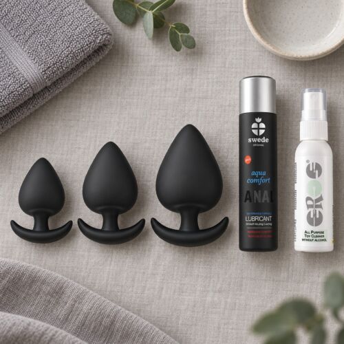 Progressive anal training kit with three silicone plugs – lifestyle scene (AI-generated image)